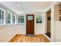 Inviting entryway with wood floors, coat hooks, windows, and access to other rooms at 29 Silver Spruce, Boulder, CO 80302