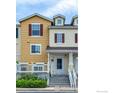 Charming townhome showcasing its covered porch, lovely landscaping, and inviting facade at 3860 Colorado Ave # C, Boulder, CO 80303