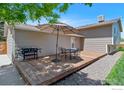 Outdoor deck perfect for entertaining, complete with a grill, seating area, and ample space for relaxation at 8963 W 75Th Cir, Arvada, CO 80005