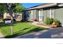 Charming home featuring a well-manicured lawn and inviting walkway at 1087 Lilac St, Broomfield, CO 80020