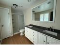 Bathroom featuring dual sink vanity and walk-in shower at 1943 Meadow Dr # B2, Longmont, CO 80501