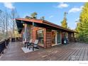 Inviting deck with outdoor seating and grill, perfect for enjoying mountain views at 216 N Gold Flake, Breckenridge, CO 80424