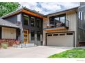 Charming two-story home features a modern design with a balcony and garage at 2575 Briarwood Dr, Boulder, CO 80305