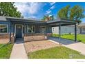 Welcoming covered entrance with stonework accents and a convenient carport at 2749 S Glencoe St, Denver, CO 80222