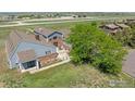 Aerial view showcases a charming backyard with a brick patio, perfect for outdoor seating and entertainment at 2875 Mooney Pl, Erie, CO 80516