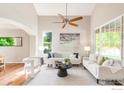 Bright living room with high ceilings, modern decor, and natural light from large windows at 2933 Hunt Ct, Erie, CO 80516