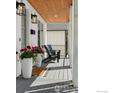 Inviting front porch with stylish decor and comfortable seating, creating a cozy outdoor space at 3256 S Corona St, Englewood, CO 80113