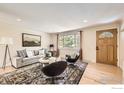 Comfortable living room with hardwood floors, large window, and cozy seating arrangement near the entryway at 630 S 45Th St, Boulder, CO 80305