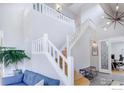 Bright entryway with staircase and open concept living space at 902 Grove Dr, Louisville, CO 80027