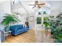 Bright living room with large windows, hardwood floors, and modern decor, creating an inviting space at 902 Grove Dr, Louisville, CO 80027