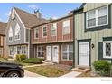 Charming townhouse with a well-maintained lawn and inviting front entrance at 1653 S Blackhawk Way # B, Aurora, CO 80012