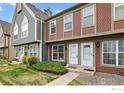 Charming townhouse with a well-maintained lawn and inviting front entrance at 1653 S Blackhawk Way # B, Aurora, CO 80012