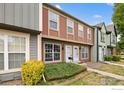 Charming townhouse with a well-maintained lawn and inviting front entrance at 1653 S Blackhawk Way # B, Aurora, CO 80012