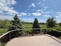 Enjoy outdoor living on this spacious deck with lovely views of the lush greenery at 2335 Dogwood Cir, Louisville, CO 80027