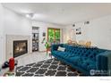 Bright living room with a cozy fireplace and sliding glass doors to the balcony at 2802 Sundown Ln # 102, Boulder, CO 80303