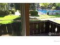 Balcony with views of community pool and landscaping, offering a tranquil outdoor space at 3250 Oneal Cir # 14, Boulder, CO 80301