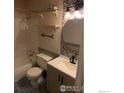 Cozy bathroom features updated vanity, modern fixtures, and mosaic tile accent wall at 3250 Oneal Cir # 14, Boulder, CO 80301