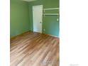Inviting bedroom with hardwood floors, neutral paint, and built-in shelving for added storage at 3250 Oneal Cir # 14, Boulder, CO 80301