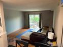 Bright living room with hardwood floors and sliding glass doors to a patio at 3250 Oneal Cir # 14, Boulder, CO 80301