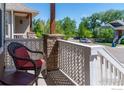 Inviting front porch with comfortable seating and a view of the neighborhood at 3341 Yukon Ct, Wheat Ridge, CO 80033