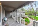 Relaxing covered porch with seating overlooking the landscaped front yard at 4157 19Th St, Boulder, CO 80304