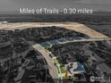 Aerial view of the home in the neighborhood with access to miles of trails .3 miles away at 515 Orion Ave, Erie, CO 80516