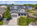 An exterior view with a well manicured yard of this home with installed solar panels at 759 Old Wagon Trail Cir, Lafayette, CO 80026