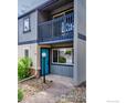 Two-story townhome with a private balcony and a cheerful teal front door at 790 W Moorhead Cir # A, Boulder, CO 80305