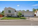 Charming two-story home with landscaped front yard and attached two-car garage at 1043 Lilac Ct, Broomfield, CO 80020