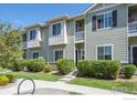 Charming two-story townhome with well-maintained landscaping, providing a welcoming curb appeal at 1426 Sepia Ave, Longmont, CO 80501