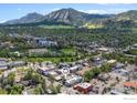 Enjoy this vibrant Boulder location with an aerial view showcasing the building's setting near parks, and Flatiron Mountain views at 1727 15Th St # 300, Boulder, CO 80302