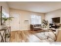 Bright living room featuring hardwood floors, modern furnishings, and large windows for plenty of natural light at 2345 N Clay St # 6, Denver, CO 80211