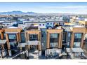 Aerial view showcasing modern townhouses with mountain views in the distance at 2361 Junegrass Ln, Superior, CO 80027