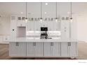 Bright, modern kitchen featuring a large island and stainless steel appliances at 2361 Junegrass Ln, Superior, CO 80027