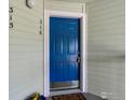 Close-up of a bright blue front door with white trim, a secure lock, and the unit number clearly displayed at 33 S Boulder Cir # 316, Boulder, CO 80303