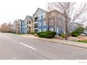 Apartment building showing the exterior with well-maintained landscaping and residential charm at 4451 S Ammons St # 307, Littleton, CO 80123