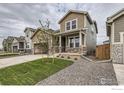 Attractive home exterior with stone accents, landscaping, and a welcoming entrance at 793 Griffith St, Lochbuie, CO 80603