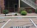 Exterior view showcasing the front of the building with landscaping and assigned parking at 804 Summer Hawk Dr, Longmont, CO 80504
