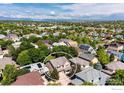 Aerial neighborhood view showcases property's location and mountain views in the distance at 13255 Red Deer Trl, Broomfield, CO 80020