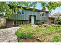 Charming split-level home with a unique front yard, featuring a combination of landscaping and architectural style at 1350 Lehigh St, Boulder, CO 80305