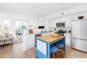 Well-lit kitchen with stainless steel appliances and a stylish island with seating at 1866 Mallard Dr, Superior, CO 80027