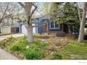 Charming single-Gathering home with a well-manicured front yard and a two-car garage at 247 Regal St, Louisville, CO 80027