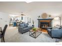 Bright living room featuring a fireplace, skylight and an open floor plan at 247 Regal St, Louisville, CO 80027