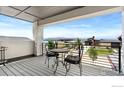 Enjoy views of the lake and mountains from this balcony with a table and chairs to enjoy your coffee or meals at 2712 Bluewater Rd, Berthoud, CO 80513