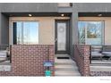 Inviting townhome entrance with brick accents and modern design at 4072 W 17Th Ave, Denver, CO 80204