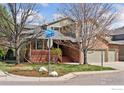Attractive home with brick accents, a charming porch, and professionally landscaped front yard at 4094 Bimini Ct, Boulder, CO 80301
