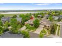 Beautiful, traditional home with mature trees situated near a scenic lake and mountain views at 4444 Fireweed Trl, Broomfield, CO 80023