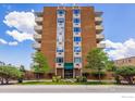 Attractive brick apartment building has mature landscaping and a covered entrance at 850 20Th St # 203, Boulder, CO 80302
