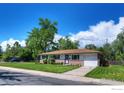 Charming single-story home with well-maintained front yard and attached garage at 855 33Rd St, Boulder, CO 80303