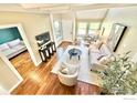 Bright living room with hardwood floors, skylight, neutral tones, and comfortable seating area at 93 Benthaven Pl, Boulder, CO 80305